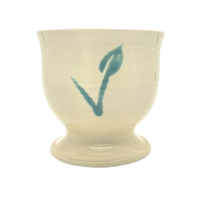 handmade ceramic goblet features a green flower