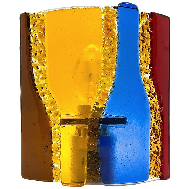 A fused glass night light. It shows four wine bottles, two are upside down. They are four different colors; brown, yellow, blue & red. It is on a yellow background.