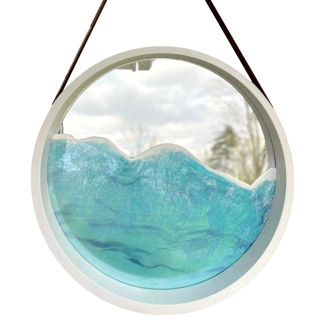 Mirror features a white frame and strap for hanging