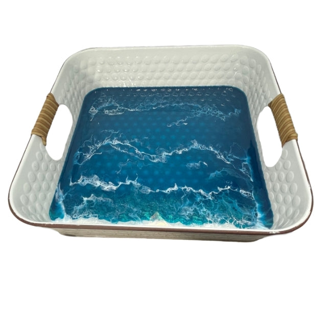 serving trays come with wood wrapped handles and feature ocean waves.